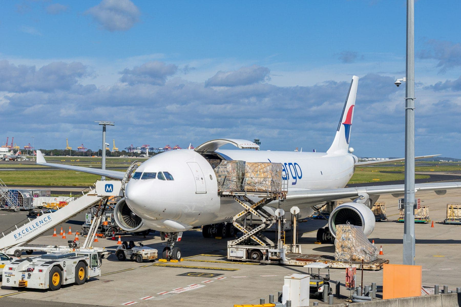 Cargo pallets being loaded into a freighter aircraft